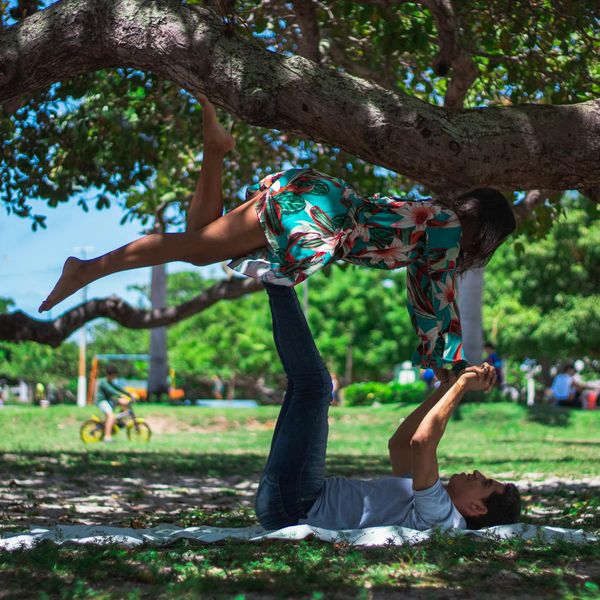 Woman feeling energetic and balanced during a yoga practice outdoors.